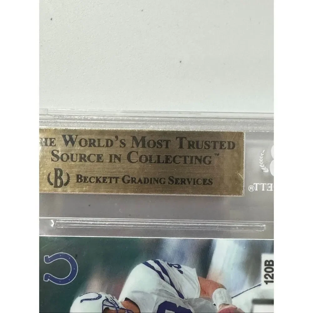 1998 Peyton Manning Fleer Brilliant Blue Rookie card. Beckett 9.5